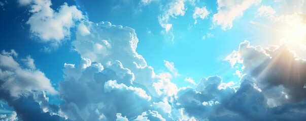 Bright sunbeams shining through fluffy white clouds in a vivid blue sky