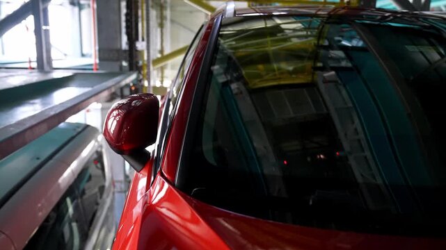 Cars moving inside an intelligent elevator parking system. A modern engineering and automation solution providing space efficiency in urban areas.