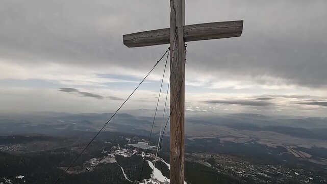 A wooden cross erected on one of the peaks of the High Tatras, Slovakia. View from the summit of Mount Peredni Solisko towards &Scaron;trbsk&eacute; Pleso.