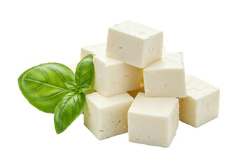 Feta cheese cubes with basil leaves isolated, fresh dairy product for healthy eating and Mediterranean cuisine