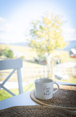 hot drink and open book on cozy kitchen table