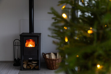 lights on a Christmas tree and fireplace in background