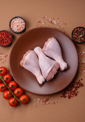 Raw chicken legs, poultry meat on the bone for barbecue. Chicken legs as a food background
