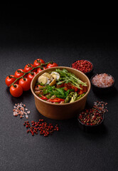 Seared tuna tataki in a bowl with sesame seeds, rice, and vegetables. Tuna tataki