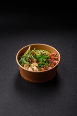 Seared tuna tataki in a bowl with sesame seeds, rice, and vegetables. Tuna tataki