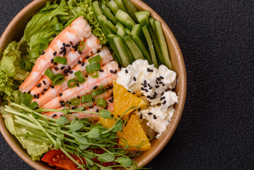 A prawn or shrimp bowl with rice, tomatoes, sauce, and vegetables, Asian food. Prawn or shrimp