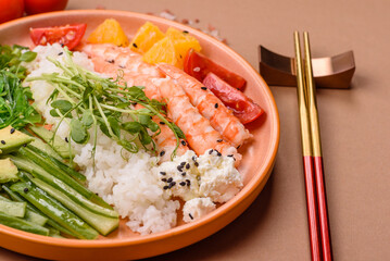 A prawn or shrimp bowl with rice, tomatoes, sauce, and vegetables, Asian food. Prawn or shrimp