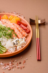 A prawn or shrimp bowl with rice, tomatoes, sauce, and vegetables, Asian food. Prawn or shrimp