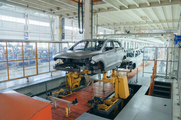 Audit department at the passenger car production plant, quality control of vehicle assembly in a batch.