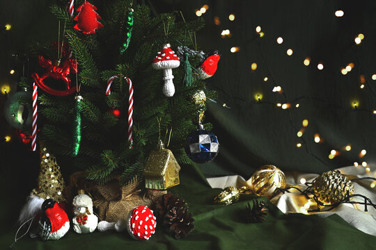 Merry Christmas. Retro style. Retro Christmas toys. Knitted red fly agaric mushroom to decorate the Christmas tree. DIY toys. Holiday with children. Cozy home on Christmas eve.