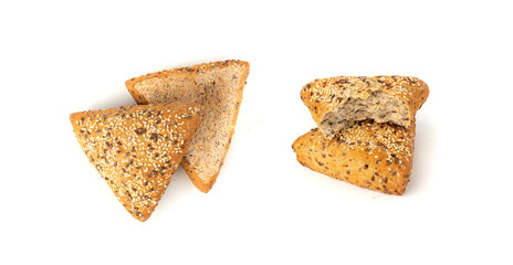 Triangular bun isolated. Wheat bread with sesame and flax seeds, healthy whole grain bakery