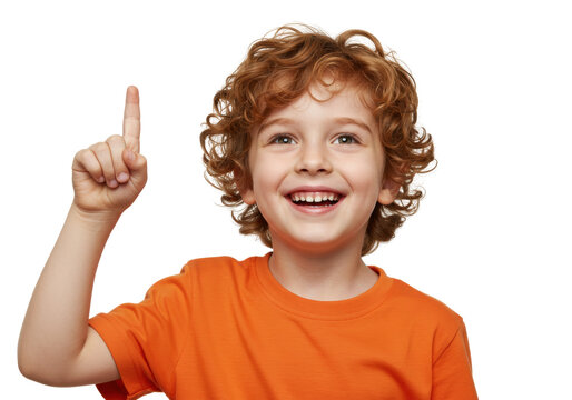 Happy red-haired boy in orange shirt pointing up isolated PNG, cheerful child with curly hair on transparent background, idea concept