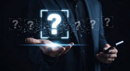 Businessman holding holographic question mark in dark suit with smartphone