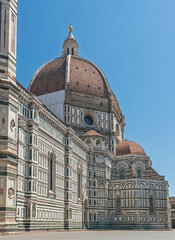 Naklejka premium Firenze, Italy, Europe - July 14, 2024: Cathedral of Saint Mary of the Flower. Giant dome above the Chancel and the south transept on Piazza del Duomo