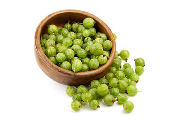 Fresh green gooseberries spilling from a wooden bowl, showcasing their vibrant color and texture, perfect for culinary uses and healthy eating concepts