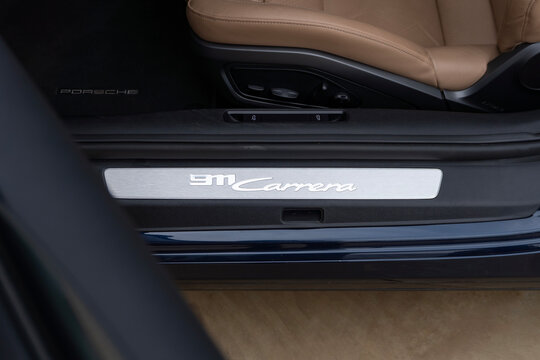 Porsche 911 Carrera door sill plate, luxury sportscar entry detail