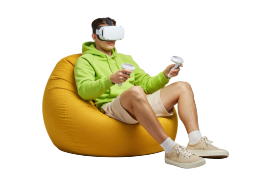 Man with VR headset and controllers sitting on beanbag isolated PNG, experiencing virtual reality for gaming and immersive entertainment