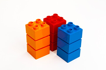 Vibrant Stacked Toy Bricks on White Background