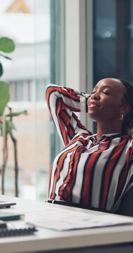 Stretching, close laptop or black woman in office with smile, relax and completed task in deadline. Space, finished or analyst in agency with tech, satisfaction or time management in target reach.