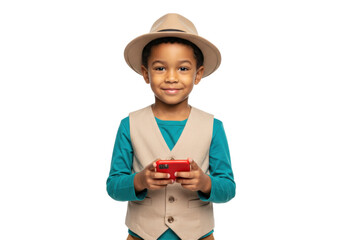 Smiling African boy in hat with red phone isolated on transparent PNG, happy child using smartphone for communication and entertainment