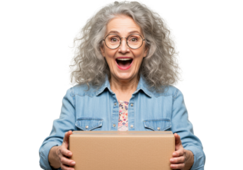 Excited senior woman with a cardboard box isolated on transparent background, receiving a package and smiling with joy