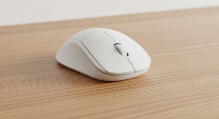 White computer mouse resting on a light wooden surface.