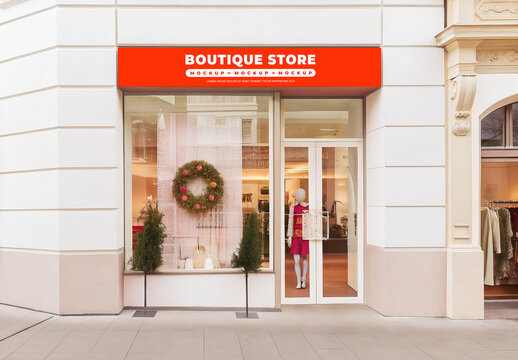 Boutique Store Front Signage Mockup with Wreath on Building Entrance at Day