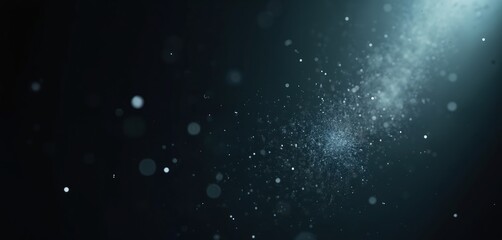 Tiny particles float in dark air creating a bokeh effect. Light illuminates dust clouds and fine specks, suggesting abstract motion or a magical atmosphere.