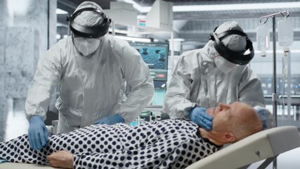 Doctors team in hazmat suits examining patient with infection symptoms in a secure laboratory, medical testing and diagnostics to prevent disease spread and support global healthcare. Camera B. - Powered by Adobe