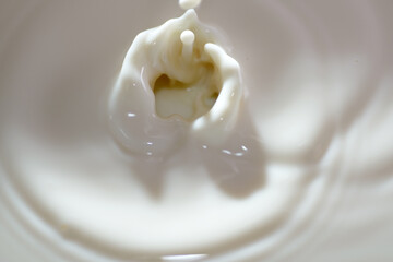 Top view of hot milk splash as background