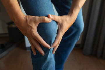 Man with pain in his knee  