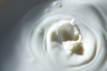 Top view of hot milk splash as background