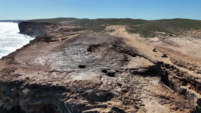 aerial drone footage of blowholes along rugged rocky coastline near steep point, the western most spot of Australia near Fracois Peron national park and shark bay along the shores of the indian ocean.