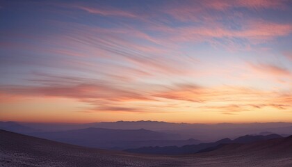 Morning Sky with Cirrus Clouds and Distant Mountains
