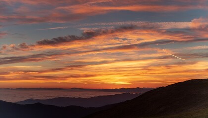Obraz premium Sunset Sky with Cirrus Clouds and Mountain Silhouette 