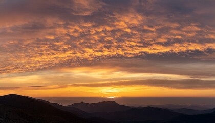 Obraz premium Sunset Sky with Cirrus Clouds and Mountain Silhouette 