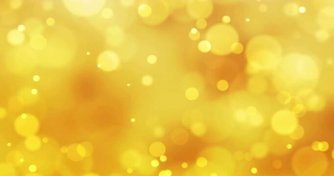Initial golden discs emerging while shimmering bokeh particles drifting across frame for glow