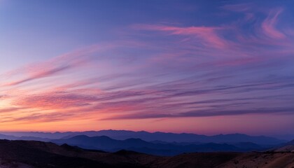 Fototapeta premium Purple Evening Sky with Cirrus Clouds and Mountain Silhouette 