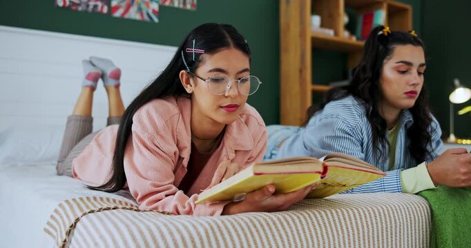 Friends, students and girls reading book in bedroom, studying and scroll on phone to relax in home. Young, bed and learning together for education, knowledge or college test preparation in university