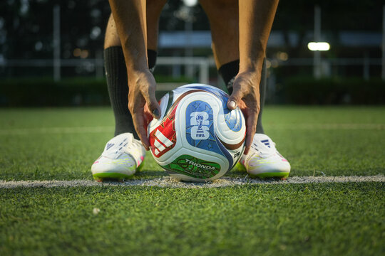 Bangkok, Thailand - 17 October 2025: Adidas launch "Trionda" the official match ball for Fifa World Cup 2026 that co-host with USA, Canada and Mexico. It on the football training pitch.