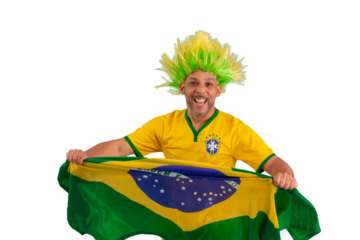 male fan wearing a yellow Brazilian football shirt and the Brazilian flag