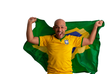 male fan wearing a yellow Brazilian football shirt and the Brazilian flag