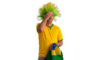 male fan wearing a yellow Brazilian football shirt and the Brazilian flag