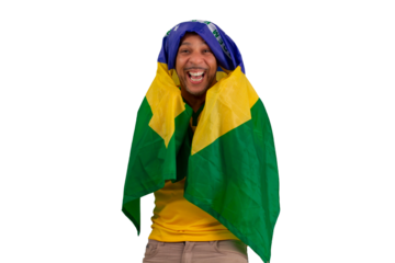 male fan wearing a yellow Brazilian football shirt and the Brazilian flag