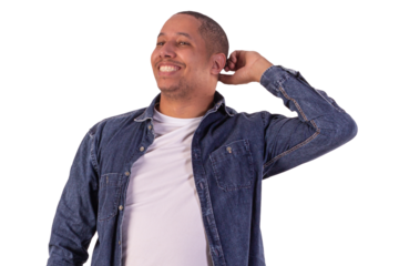 Young adult man wearing a blue denim jacket, with a white shirt in studio shots with a pink background and making various facial expressions showing various feelings