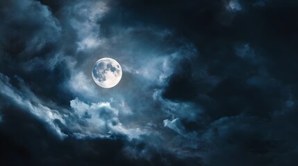 Full moon shines through dark, stormy clouds at night.