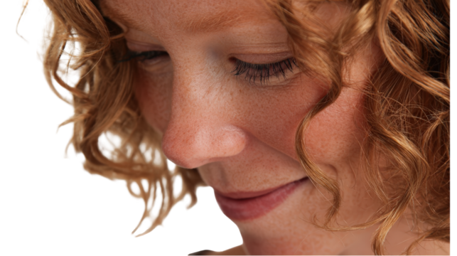 Close up portrait of a thoughtful woman with curly hair isolated on transparent background.