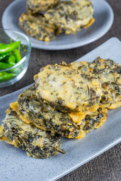 rolade tahu daun singkong is a savory fried dish made from a mixture of tofu, cassava leaves and spices, then shaped and fried. indonesia food