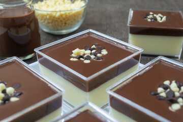 Cheese pudding with delicious chocolate sauce on top, served in a pudding cup. sweet foods