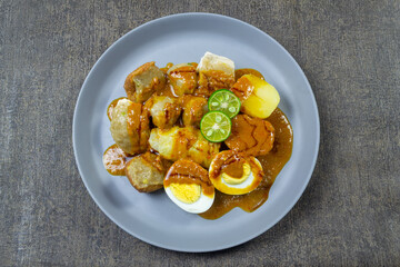 Siomay (also somai) is a Chinese-Indonesian steamed fish dumpling with vegetables served in peanut sauce